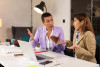 Intense conversation between two businesswomen in office